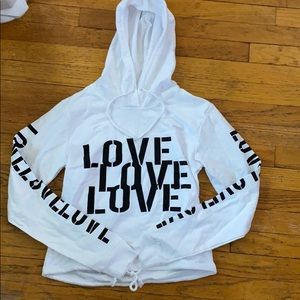 A white hoodie with love written on it